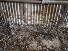 A wrought iron guard or railing.