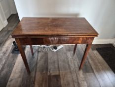 A pair of mahogany fold over games tables, each measuring 89 x 91 extended, by 75cm high.