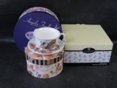 Three boxed single cup and saucer sets.