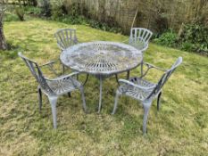 A cast aluminium garden table with four chairs. Table approx 130cm dia.