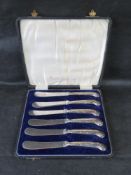 A set of hallmarked silver handled butter knives in fitted box.