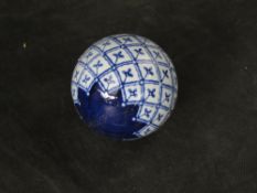 A contemporary Chinese blue and white ceramic ball.