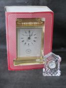 A Edinburgh crystal miniature mantle clock together with a modern brass carriage clock.