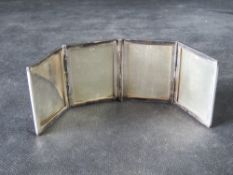 Asprey; a hallmarked silver travel photo frame for four images, 108.4g inc perspex.