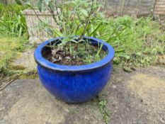 Three large blue glazed garden pots.