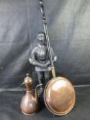 A copper jug together with a copper warming pan and a cast metal poker stand (poker deficient).