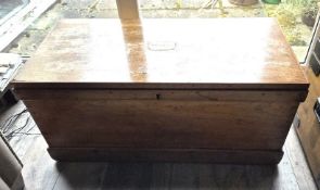 A large pine blanket box having brass end handles and brass plate for 'Tremaine' to lid,