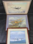 Three framed prints of planes.