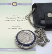 A Franklin Mint 'Timber Wolf' pocket watch, accented in silver with artwork by Ted Crown,