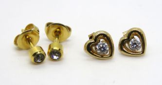 A pair of yellow metal heart shaped earrings, no apparent hallmarks,