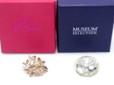 Two silver foliate brooches in presentation boxes.