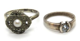 Two silver rings, sizes N and U.
