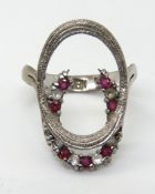 A pink and white stone horseshoe ring, i