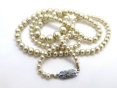 A fine set of faux pearls.