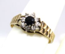 A 9ct gold sapphire and white stone floral cluster ring, hallmarked 375, size P, 2g.