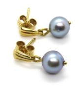 A pair of coloured pearl earrings, butterfly backs stamped 750.
