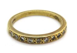 An 18ct gold diamond half eternity ring, hallmarked 750, size O, 3g.