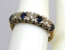 An 18ct gold sapphire and diamond ring, hallmarked 750, size N, 3.4g.