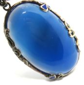 A large silver and blue stone pendant, 5