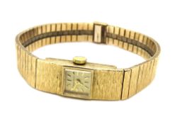 A 9ct gold ladies Jean Benett wristwatch, on integral 9ct gold strap, hallmarked 375,