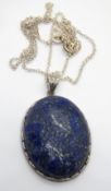 A large silver and lapis lazuli pendant