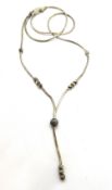 A silver chain necklace with bead decoration.