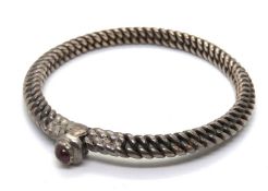 A heavy hand made bangle, no apparent ha