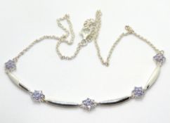 A silver floral panel necklace, stamped