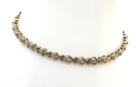 A diamond tennis bracelet, hallmark indistinct, 4.