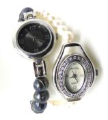 Two ladies wristwatches with pearl strap