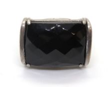 A cocktail ring having large faceted bla