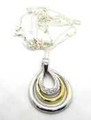 A modernist style silver pendant on silv