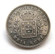 A silver coin brooch.