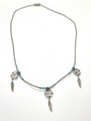 A silver and turquoise Native American b