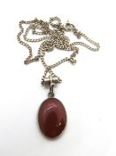 A hallmarked silver and carnelian pendant, on silver chain, pendant approx 2.