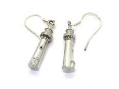 A pair of lighthouse themed earrings.