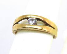 A diamond ring, split design in yellow metal, indistinct marks (possibly 750 for 18ct gold),
