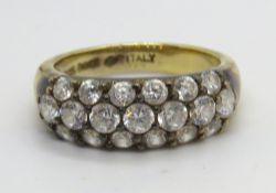 A silver ring encrusted with CZ stones, size N.