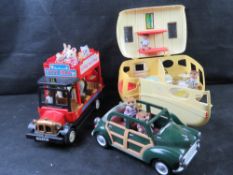 Sylvanian Families car and caravan with family, together with open top bus with various characters.