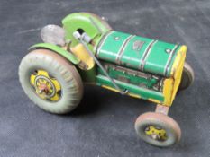 A vintage Mettoy Playthings tin clockwork tractor