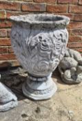 A concrete two part baroque-style flower pot