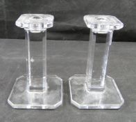 A pair of Jasper Conran for Stuart Crystal candlesticks features a modern hexagonal column design.