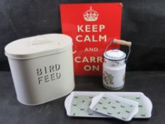 A quantity of decorative homewares including large metal bird feed tin.