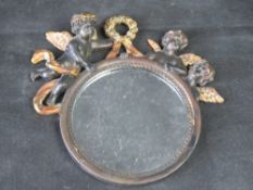 A small 19th century wall mirror having Putti or Cherubs over, Glass is 12.