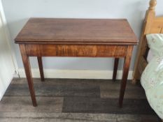 A pair of mahogany fold over games tables, each measuring 89 x 91 extended, by 75cm high.