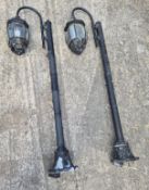A pair of garden floor standing lights.