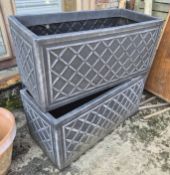 A pair of plastic planters.