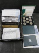 Twelve base metal proof coin sets together with a five shilling crown base metal proof coin set.