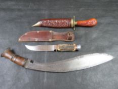 A horn handled hunting dagger, together with a kukris and a decorative dagger.