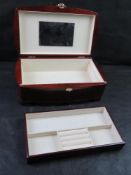 A wooden jewellery box having drop in tray.